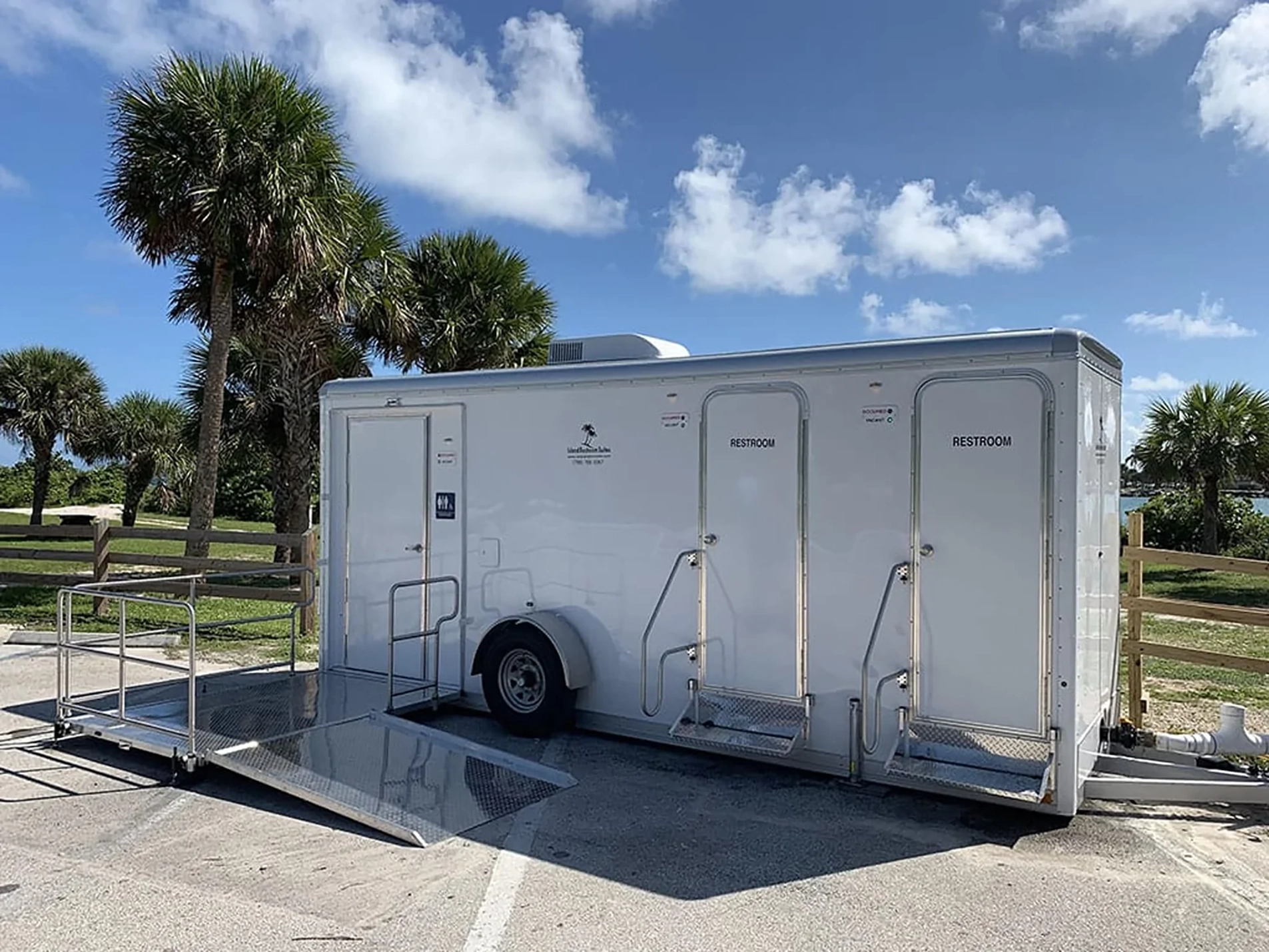 Large Portable Restroom Trailer in Sunny Outdoor Setting